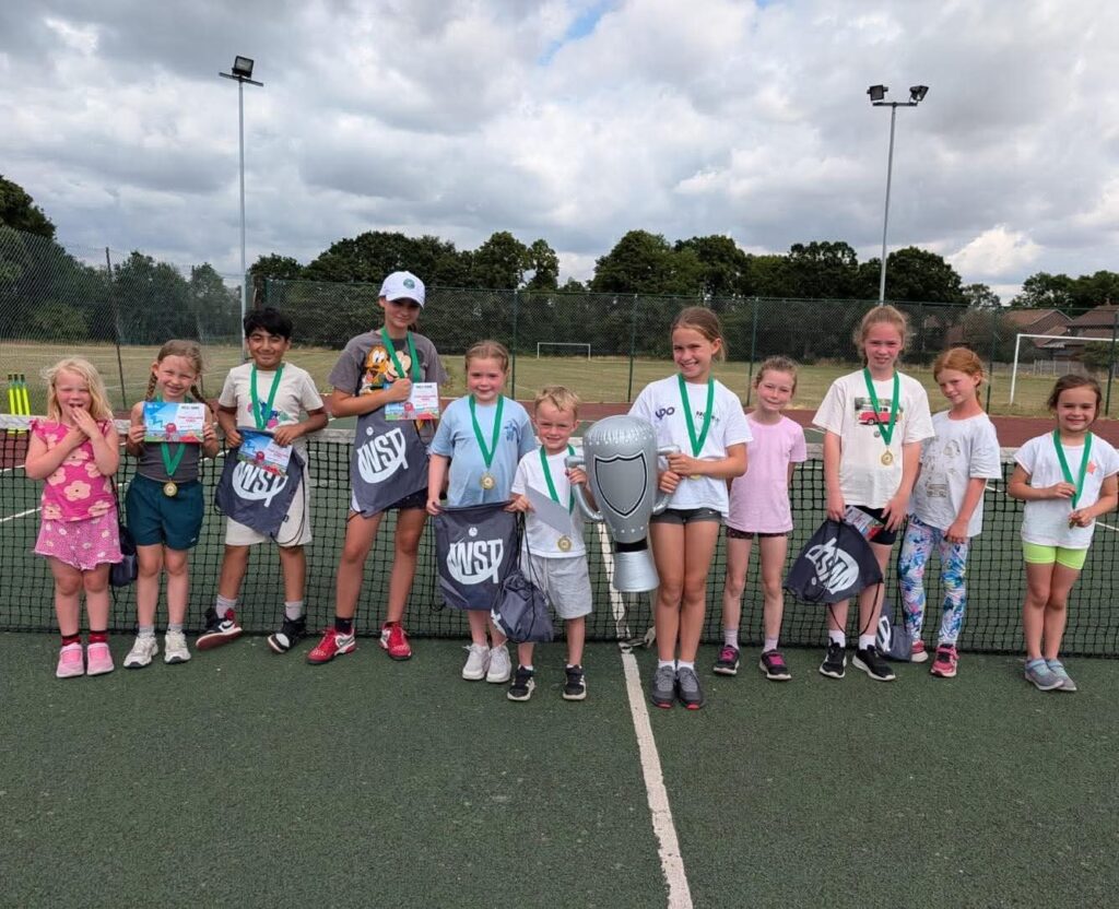 children at a tennis court